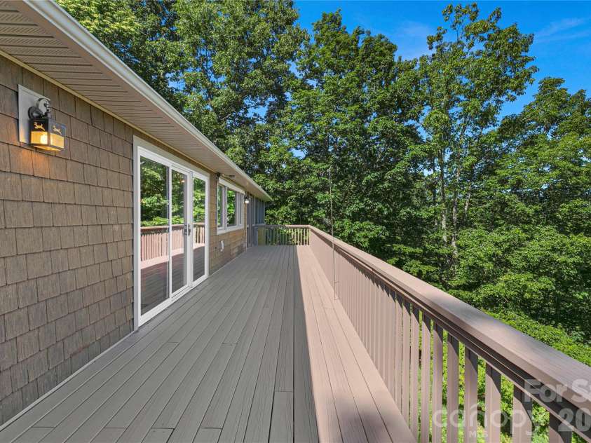 157 Kawani Lane, Brevard, NC 28712.  MLS# CAR4393607, YatesRealty ID 48172. Back deck