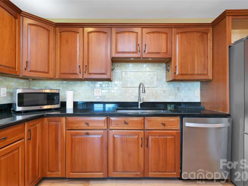 157 Kawani Lane, Brevard, NC 28712.  MLS# CAR4393607, YatesRealty ID 48172. Custom cherry cabinets