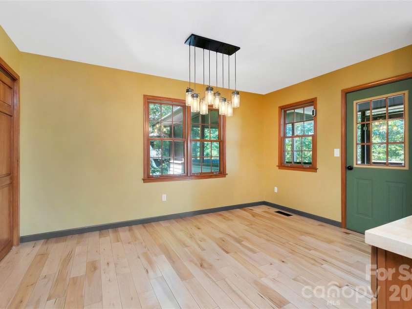 157 Kawani Lane, Brevard, NC 28712.  MLS# CAR4393607, YatesRealty ID 48172. Dining area
