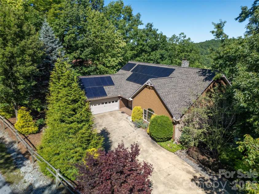 157 Kawani Lane, Brevard, NC 28712.  MLS# CAR4393607, YatesRealty ID 48172. Mature landscaping