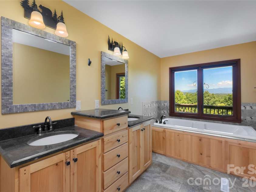 157 Kawani Lane, Brevard, NC 28712.  MLS# CAR4393607, YatesRealty ID 48172. Primary bath