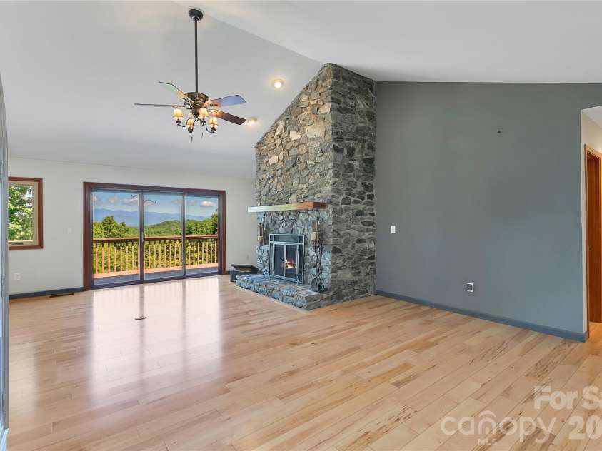 157 Kawani Lane, Brevard, NC 28712.  MLS# CAR4393607, YatesRealty ID 48172. Real stone fireplace