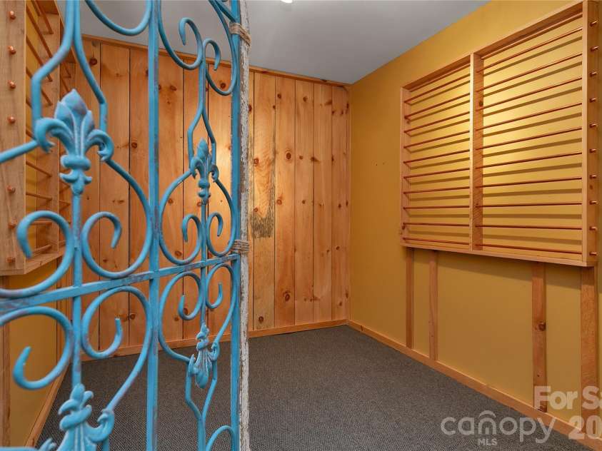 157 Kawani Lane, Brevard, NC 28712.  MLS# CAR4393607, YatesRealty ID 48172. Wine celler