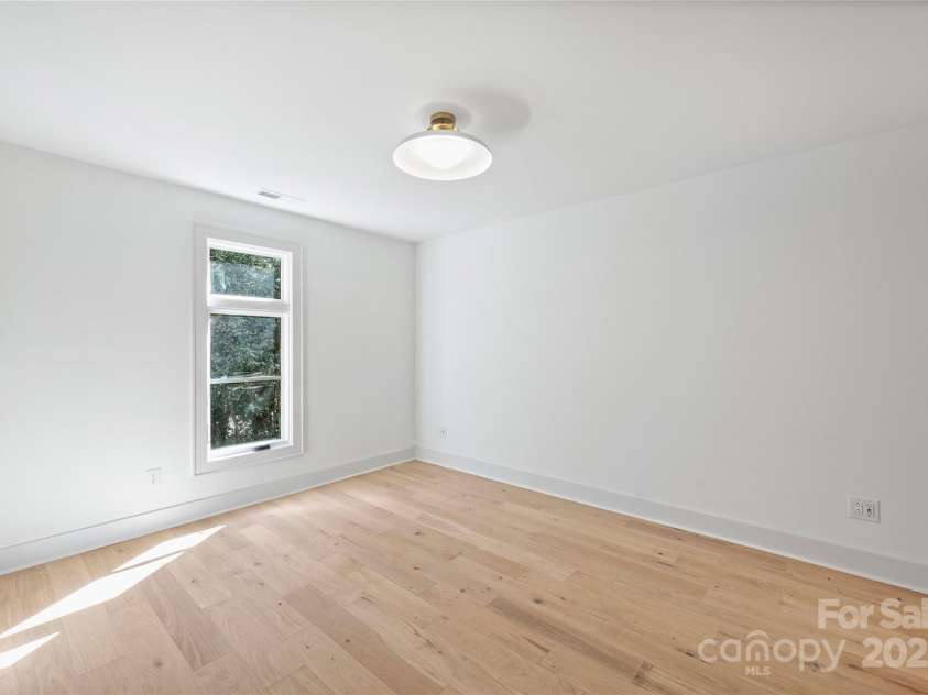 2023 Thurmond Place, Charlotte, NC 28205.  MLS# CAR4206034, YatesRealty ID 482. Guest bedroom/Office w connected bath. Representative from last completed unit.