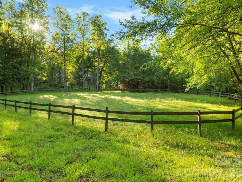 31 Ashbrook Meadows, Fletcher, NC 28732.  MLS# CAR4374375, YatesRealty ID 48210. Community equestrian ring