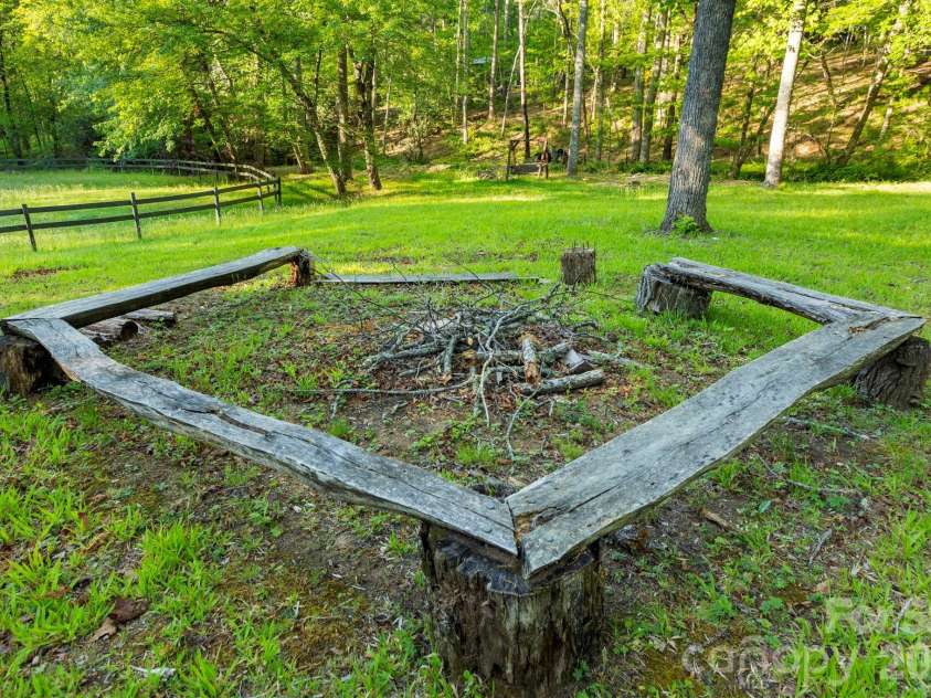 31 Ashbrook Meadows, Fletcher, NC 28732.  MLS# CAR4374375, YatesRealty ID 48210. Community firepit