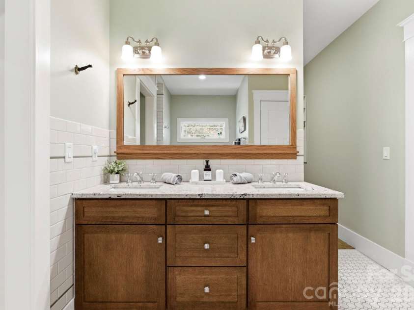 31 Ashbrook Meadows, Fletcher, NC 28732.  MLS# CAR4374375, YatesRealty ID 48210. Primary bath with dual sinks