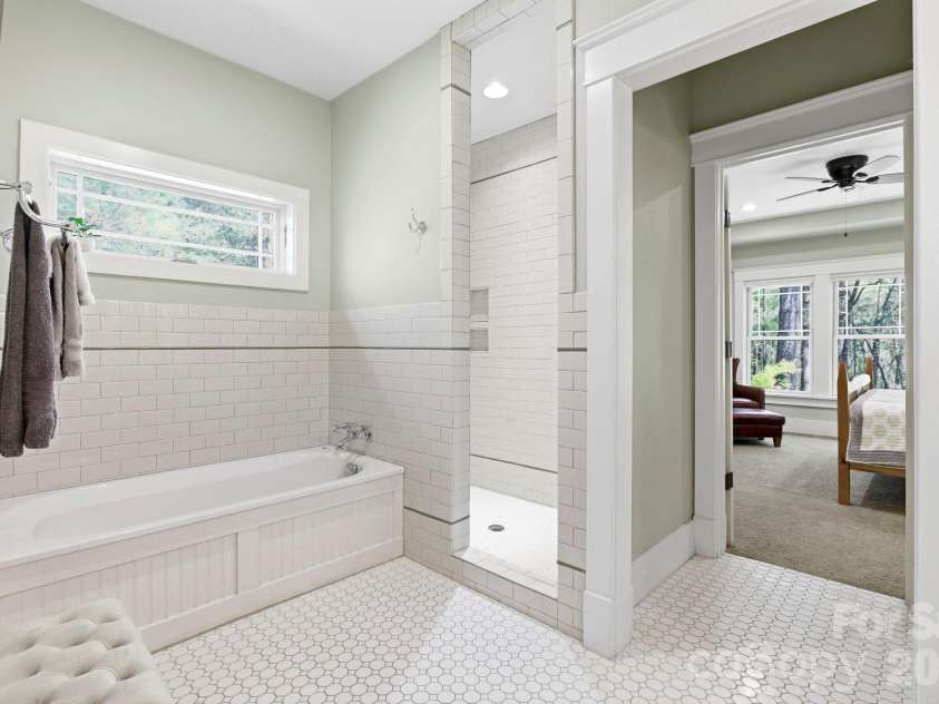 31 Ashbrook Meadows, Fletcher, NC 28732.  MLS# CAR4374375, YatesRealty ID 48210. Primary bath with soaking tub and walk-in shower