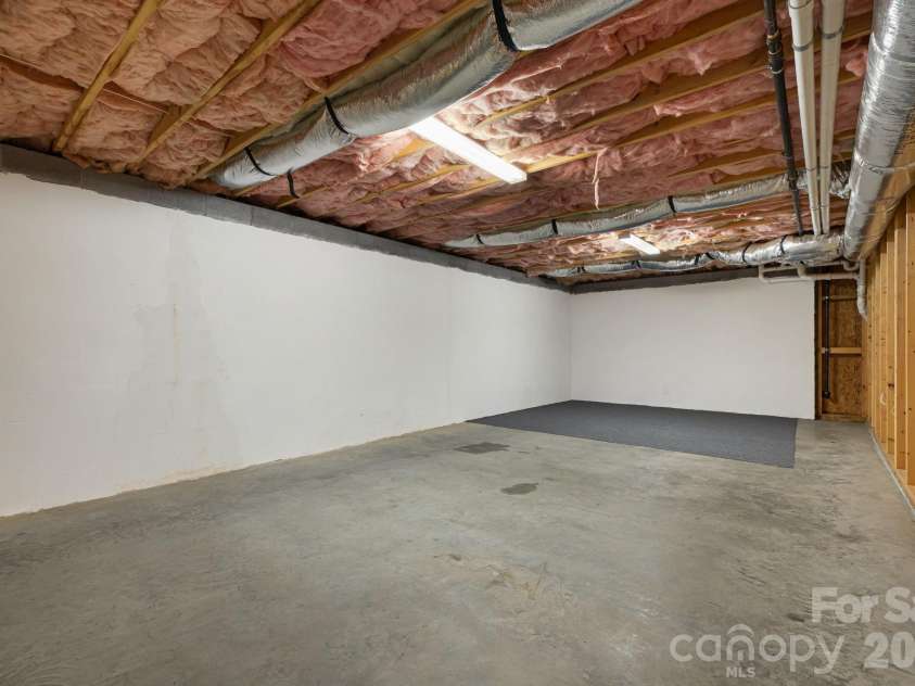 22 Wild Violet Lane, Arden, NC 28704.  MLS# CAR4420255, YatesRealty ID 48214. Expansive basement with room for projects and storage