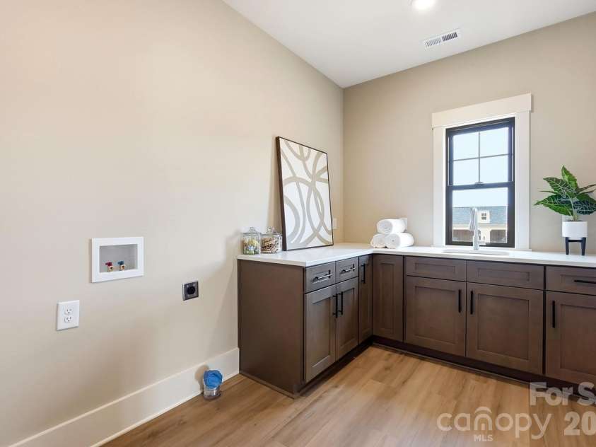 1249 Stonegate Drive, Salisbury, NC 28147.  MLS# CAR4420606, YatesRealty ID 48227. Oversized laundry with custom cabinetry.