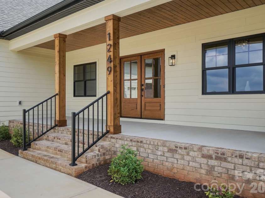 1249 Stonegate Drive, Salisbury, NC 28147.  MLS# CAR4420606, YatesRealty ID 48227. Rocking chair front porch.