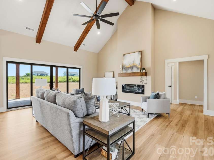 1249 Stonegate Drive, Salisbury, NC 28147.  MLS# CAR4420606, YatesRealty ID 48227. Vaulted great room features beams.