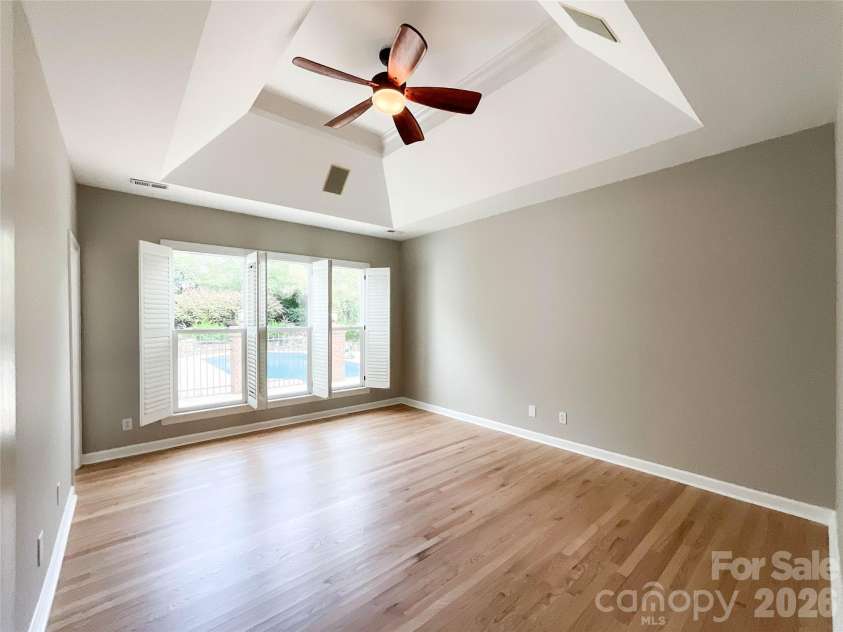 7000 Royce Court, Charlotte, NC 28277.  MLS# CAR4420656, YatesRealty ID 48241. Master Bedroom Tray Ceiling with Poolside View