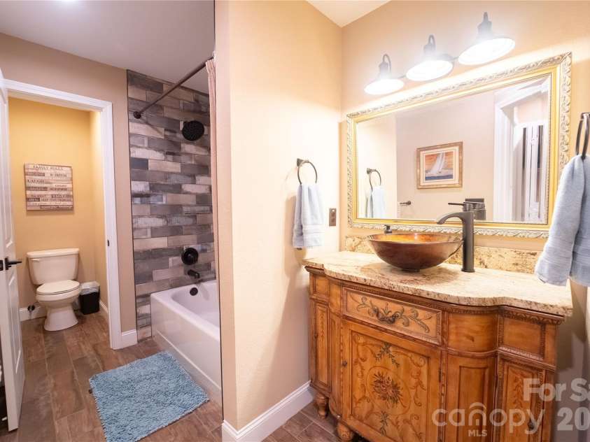 142 Southwood Drive, Brevard, NC 28712.  MLS# CAR4420666, YatesRealty ID 48250. Bottom level full bath