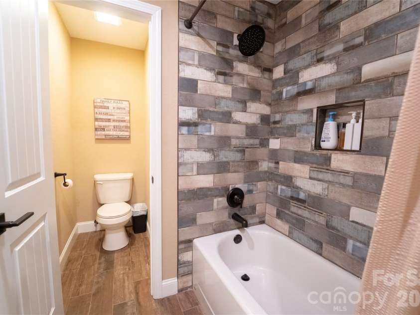 142 Southwood Drive, Brevard, NC 28712.  MLS# CAR4420666, YatesRealty ID 48250. Bottom level full bath