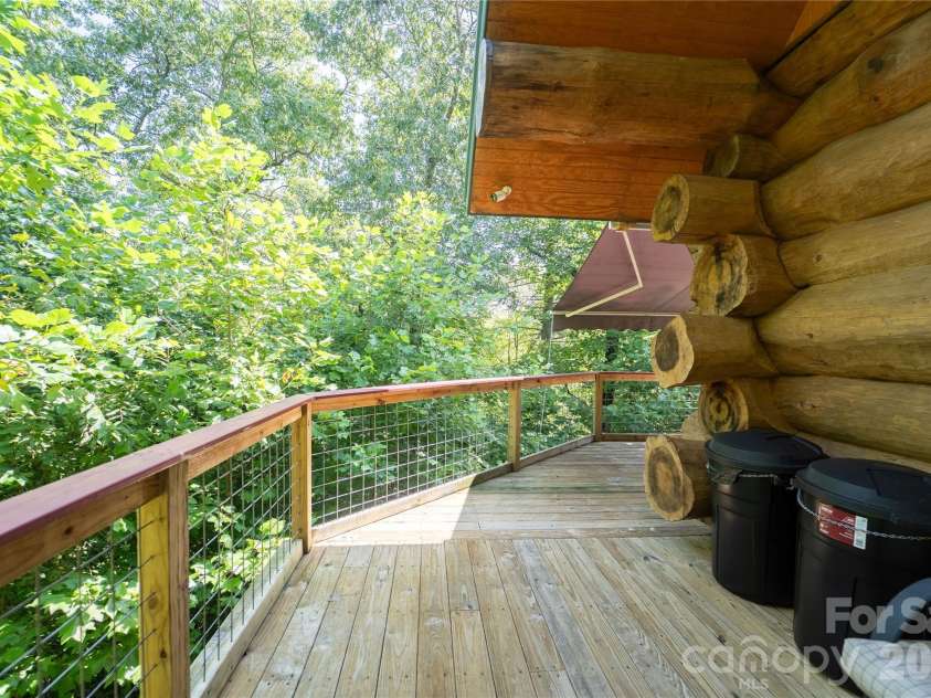 142 Southwood Drive, Brevard, NC 28712.  MLS# CAR4420666, YatesRealty ID 48250. Main level deck