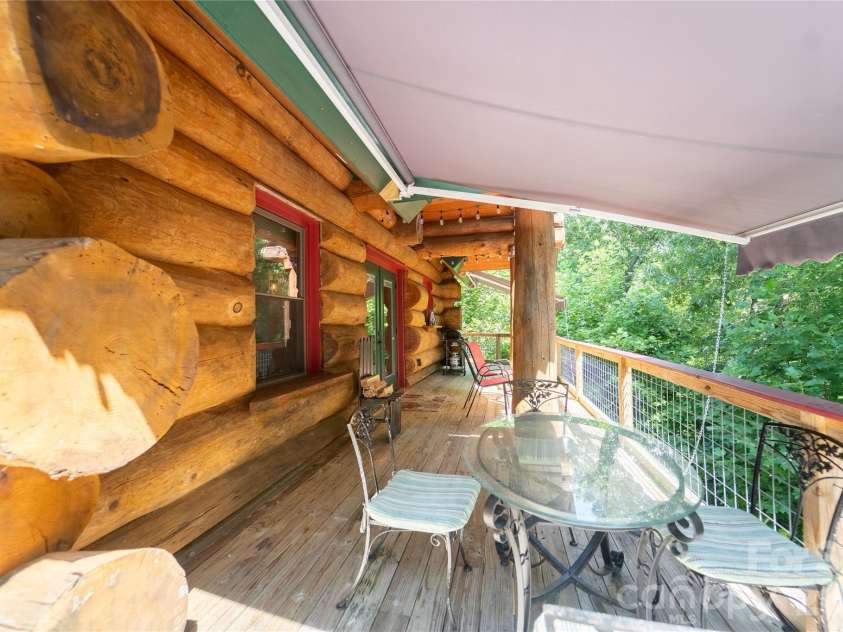 142 Southwood Drive, Brevard, NC 28712.  MLS# CAR4420666, YatesRealty ID 48250. Main level deck