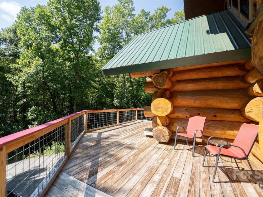 142 Southwood Drive, Brevard, NC 28712.  MLS# CAR4420666, YatesRealty ID 48250. Main level deck