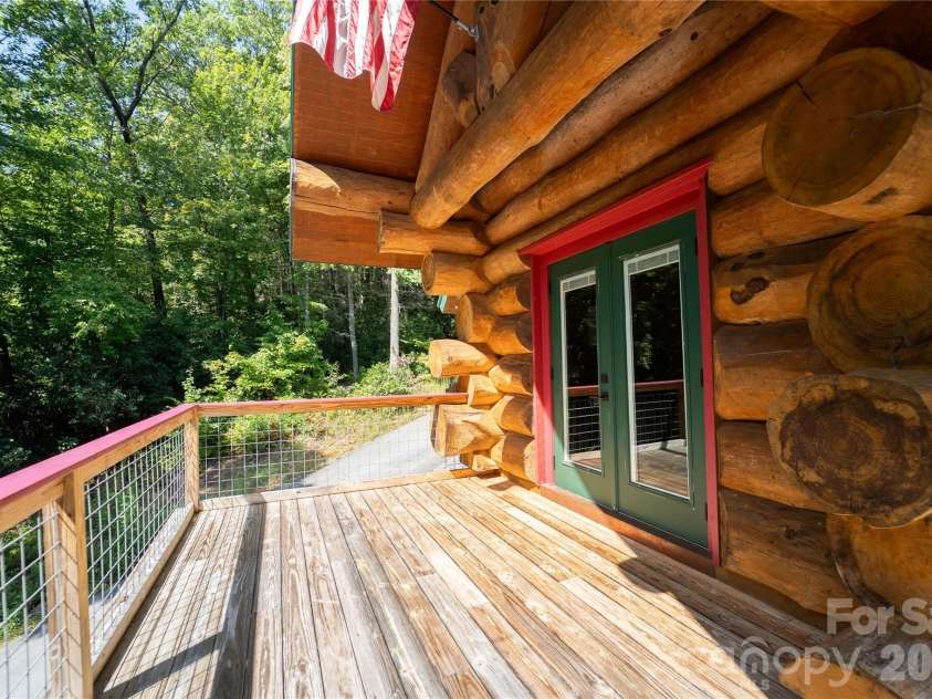 142 Southwood Drive, Brevard, NC 28712.  MLS# CAR4420666, YatesRealty ID 48250. Main level deck
