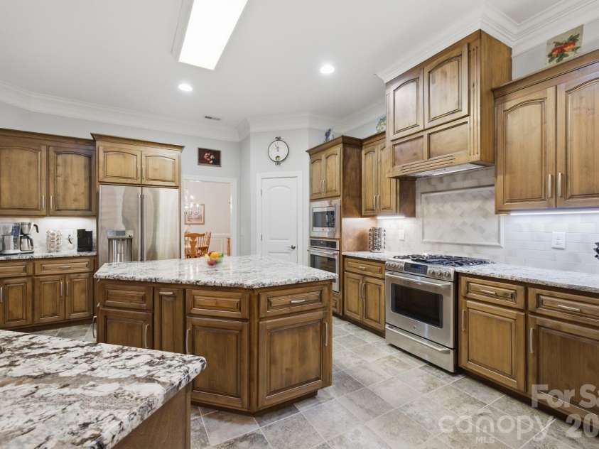 7197 Windy Ridge Drive, Iron Station, NC 28080.  MLS# CAR4417271, YatesRealty ID 48262. Gas oven, refrigerator replaced in 2025