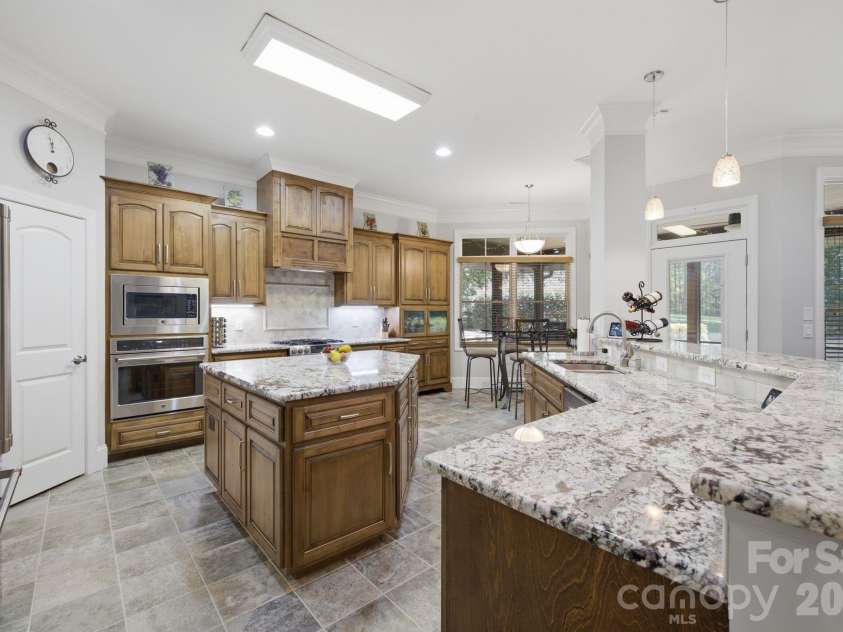 7197 Windy Ridge Drive, Iron Station, NC 28080.  MLS# CAR4417271, YatesRealty ID 48262. Granite counter tops