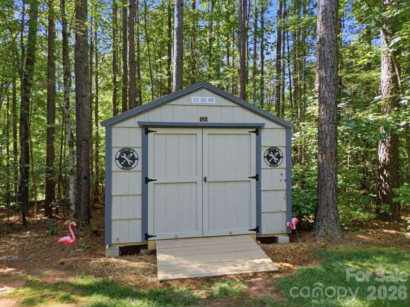 7197 Windy Ridge Drive, Iron Station, NC 28080.  MLS# CAR4417271, YatesRealty ID 48262. Storage shed for lawn equipment