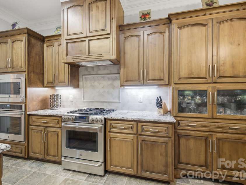 7197 Windy Ridge Drive, Iron Station, NC 28080.  MLS# CAR4417271, YatesRealty ID 48262. Varied cabinet heights and depths