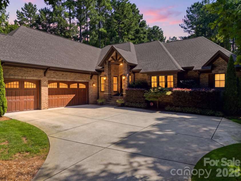 7197 Windy Ridge Drive, Iron Station, NC 28080.  MLS# CAR4417271, YatesRealty ID 48262. Virtually enhanced twilight photo