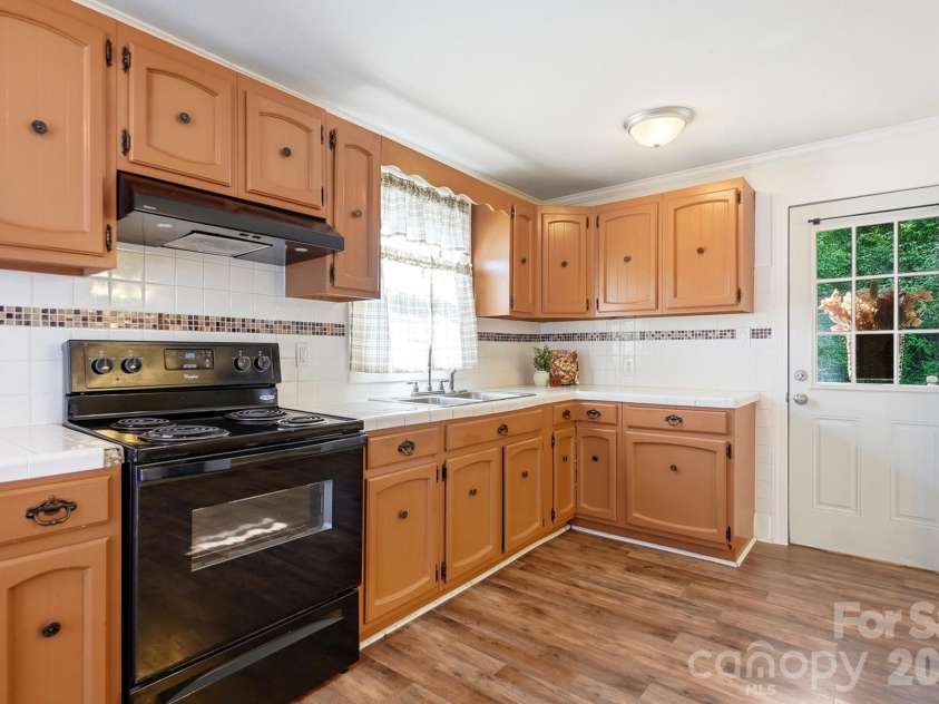 714 Parker Street, Albemarle, NC 28001.  MLS# CAR4419559, YatesRealty ID 48265. Kitchen & Laundry