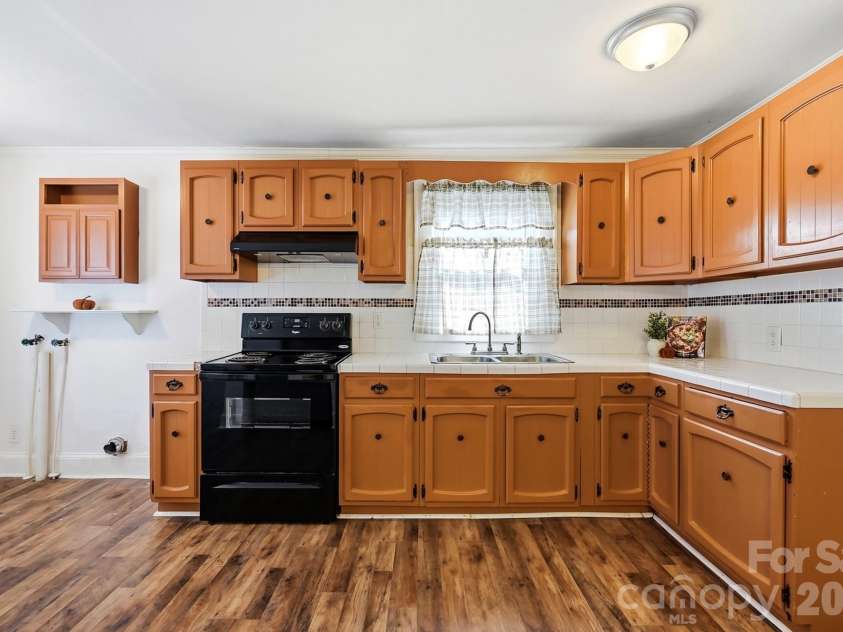 714 Parker Street, Albemarle, NC 28001.  MLS# CAR4419559, YatesRealty ID 48265. Kitchen & Laundry