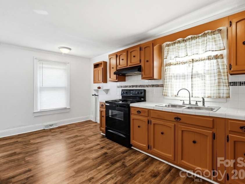 714 Parker Street, Albemarle, NC 28001.  MLS# CAR4419559, YatesRealty ID 48265. Kitchen & Laundry
