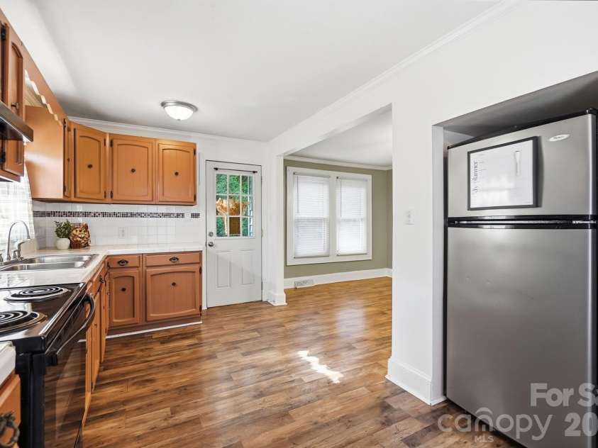 714 Parker Street, Albemarle, NC 28001.  MLS# CAR4419559, YatesRealty ID 48265. Kitchen & Laundry