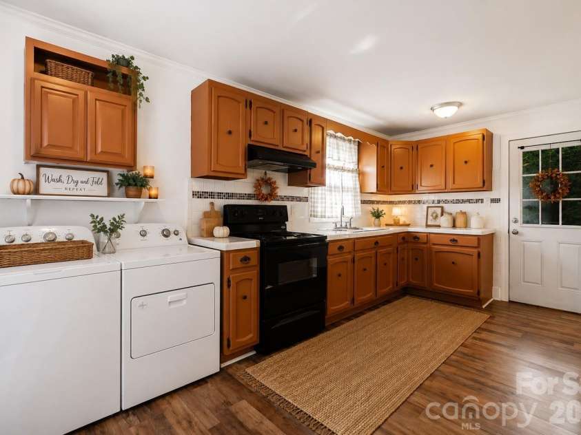 714 Parker Street, Albemarle, NC 28001.  MLS# CAR4419559, YatesRealty ID 48265. Kitchen & Laundry - Virtually Staged