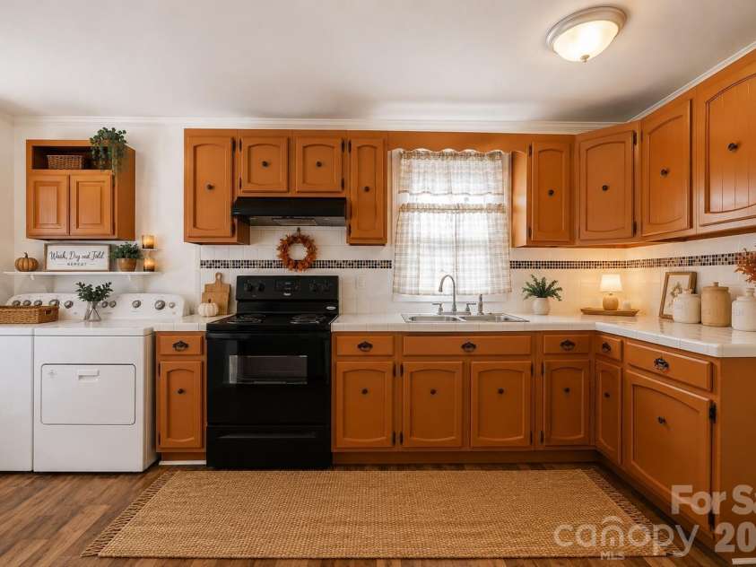 714 Parker Street, Albemarle, NC 28001.  MLS# CAR4419559, YatesRealty ID 48265. Kitchen & Laundry - Virtually Staged