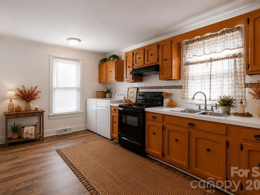 714 Parker Street, Albemarle, NC 28001.  MLS# CAR4419559, YatesRealty ID 48265. Kitchen & Laundry - Virtually Staged