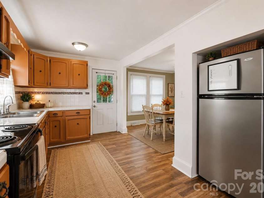714 Parker Street, Albemarle, NC 28001.  MLS# CAR4419559, YatesRealty ID 48265. Kitchen & Laundry - Virtually Staged