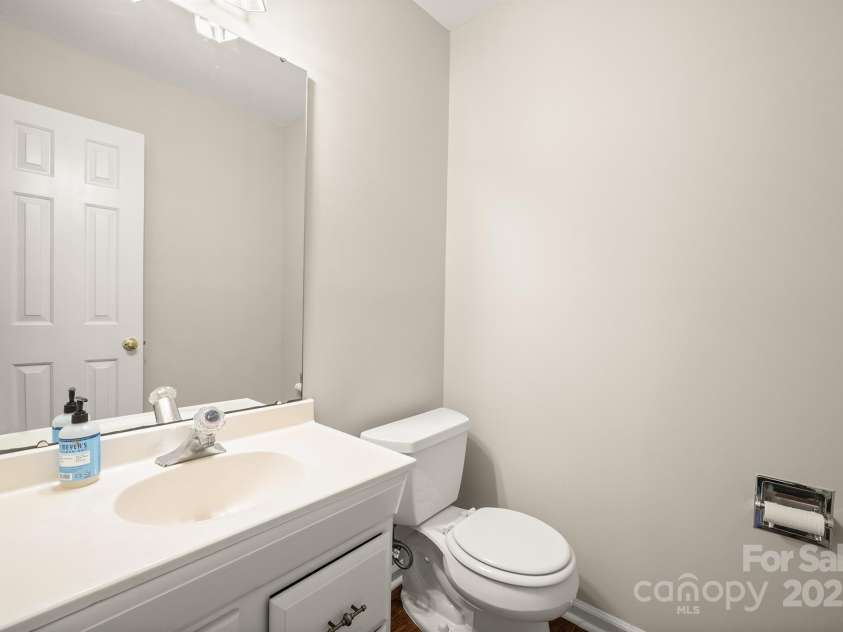 8730 Rittenhouse Circle, Charlotte, NC 28270.  MLS# CAR4225196, YatesRealty ID 4827. Powder Room Left of Stairwell