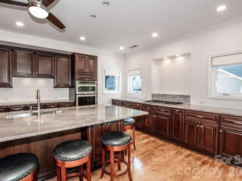 10211 Danesway Lane, Cornelius, NC 28031.  MLS# CAR4410941, YatesRealty ID 48272. Custom Kitchen with tons of counter space and cabinetry.