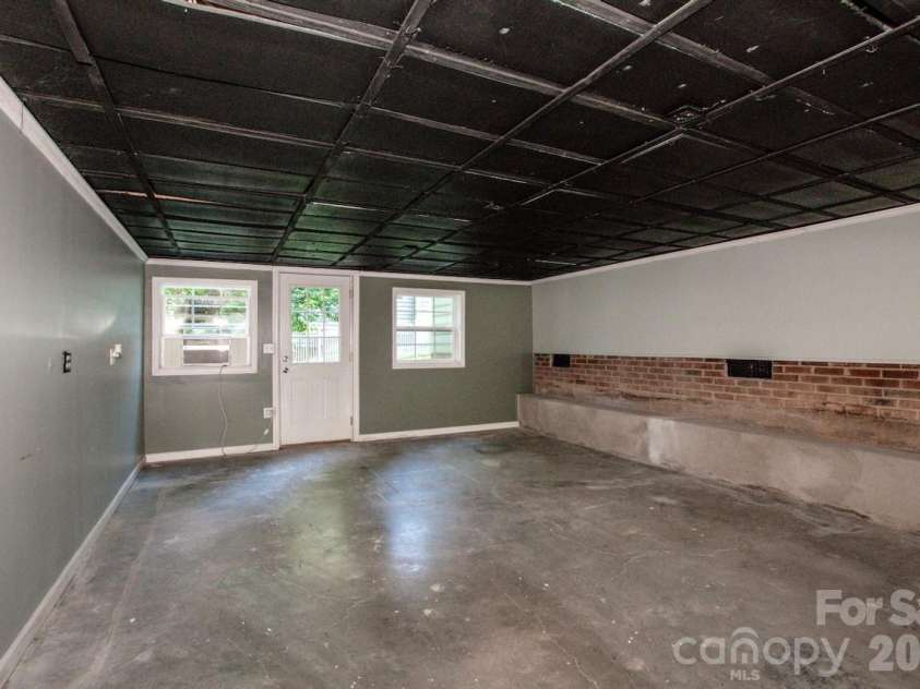 10211 Danesway Lane, Cornelius, NC 28031.  MLS# CAR4410941, YatesRealty ID 48272. Workshop below