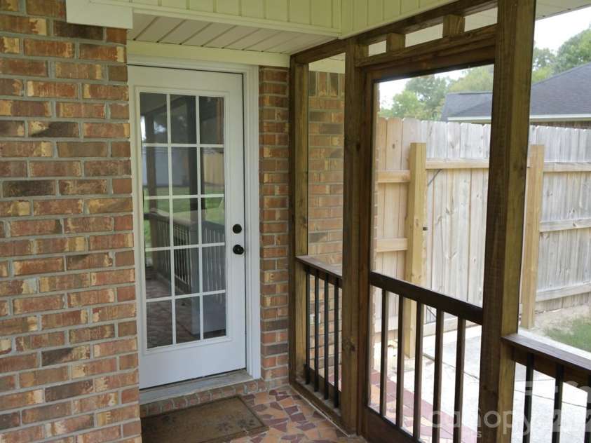 1035 Waterway Drive, Sumter, SC 29154.  MLS# CAR4420215, YatesRealty ID 48276. Covered Screened-In Porch and Back Door
