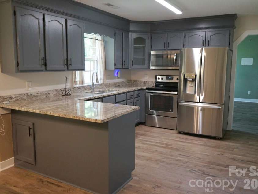 1035 Waterway Drive, Sumter, SC 29154.  MLS# CAR4420215, YatesRealty ID 48276. Kitchen with Breakfast Bar