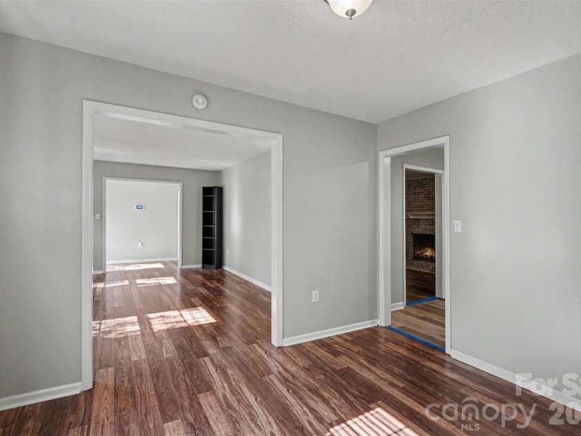 9803 Cooper Run Lane, Charlotte, NC 28269.  MLS# CAR4419711, YatesRealty ID 48278. Dining into Living Room