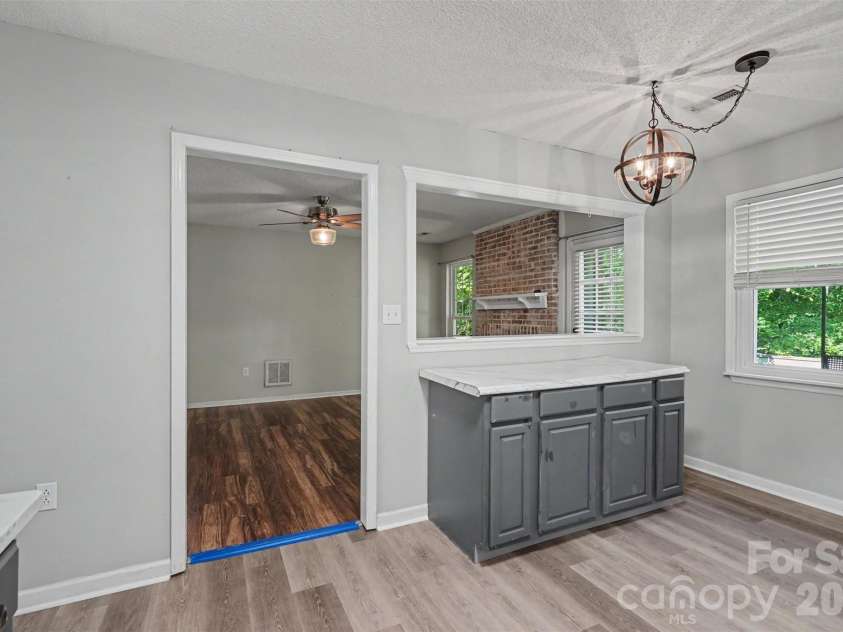 9803 Cooper Run Lane, Charlotte, NC 28269.  MLS# CAR4419711, YatesRealty ID 48278. Kitchen into Family Room