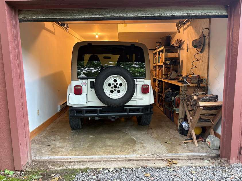 52 Steep Lane, Maggie Valley, NC 28751.  MLS# CAR4397095, YatesRealty ID 48282. Attached garage