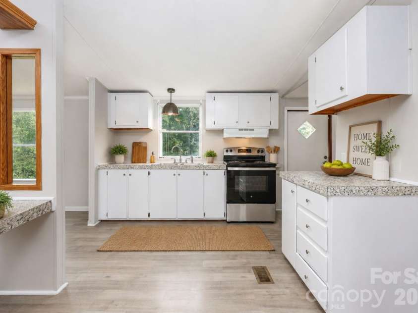 387 Haden Grove Church Road, Linwood, NC 27299.  MLS# CAR4420301, YatesRealty ID 48284. Kitchen virtually staged
