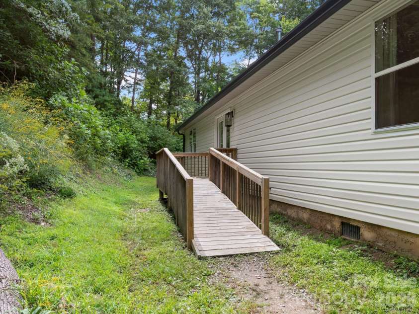 41 Bear Trail, Fairview, NC 28730.  MLS# CAR4420605, YatesRealty ID 48293. Back deck with ramp access.