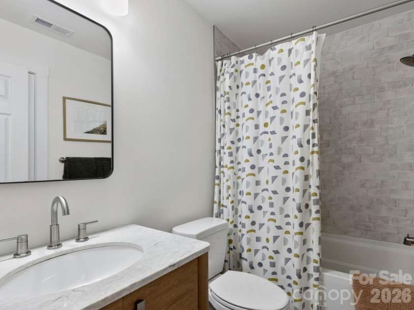 41 Bear Trail, Fairview, NC 28730.  MLS# CAR4420605, YatesRealty ID 48293. Spare bathroom with tile floors and tub surround.
