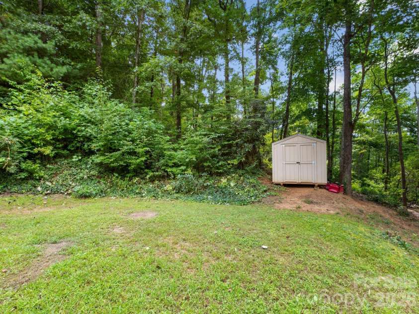 41 Bear Trail, Fairview, NC 28730.  MLS# CAR4420605, YatesRealty ID 48293. Storage shed conveys.
