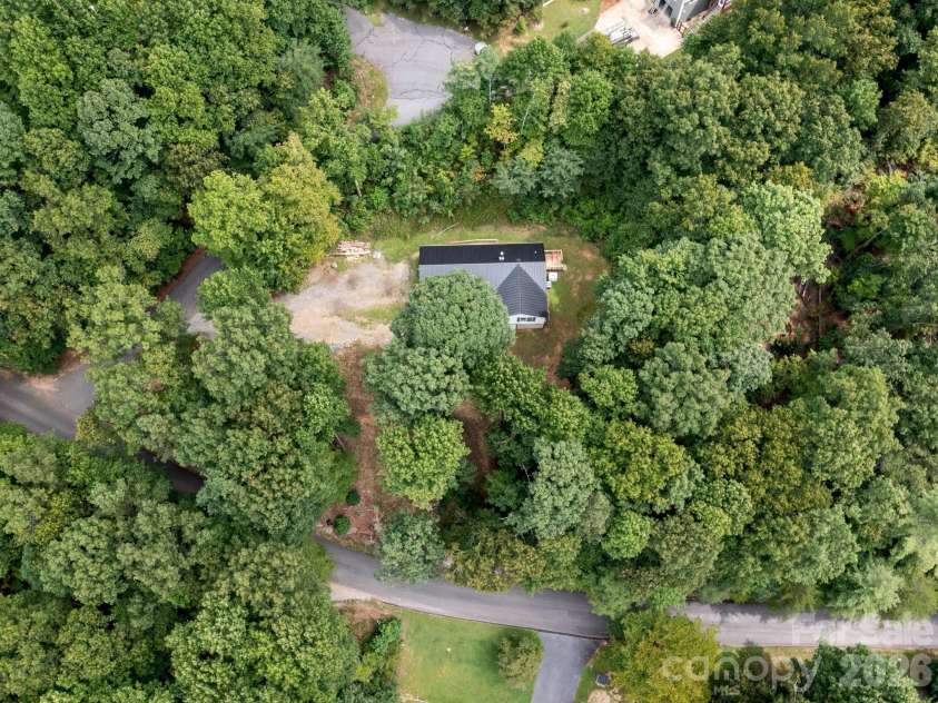 41 Bear Trail, Fairview, NC 28730.  MLS# CAR4420605, YatesRealty ID 48293. Wooded privacy on 1.11 acres.