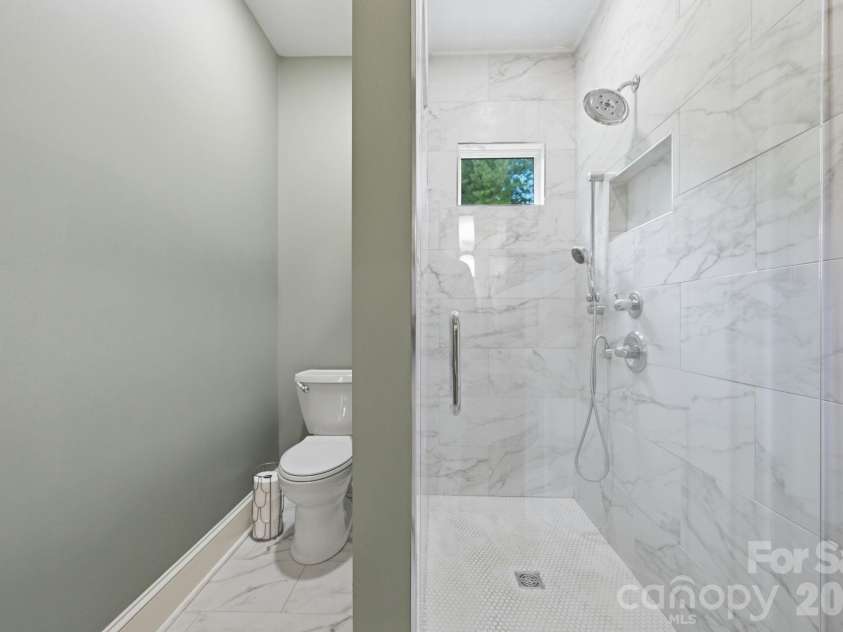 163 Walnut Drive, Jefferson, NC 28640.  MLS# CAR4420717, YatesRealty ID 48294. Ensuite Bathroom with Custom Tile Shower